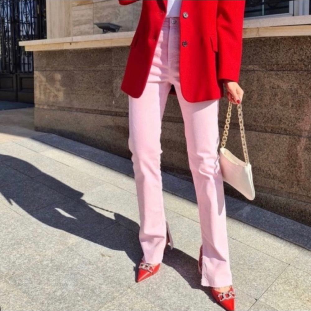 Pink high waisted ankle slit flare jeans